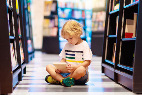 little boy with book