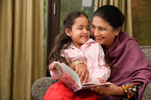 grandmother reading with grandaughter